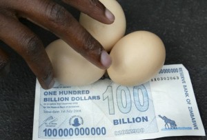 A vendor arranges eggs on a new 100 billion Zimbabwean dollar note in Harare